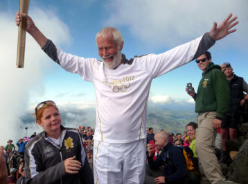 Chris Bonington with Olympic torch on Snowdon